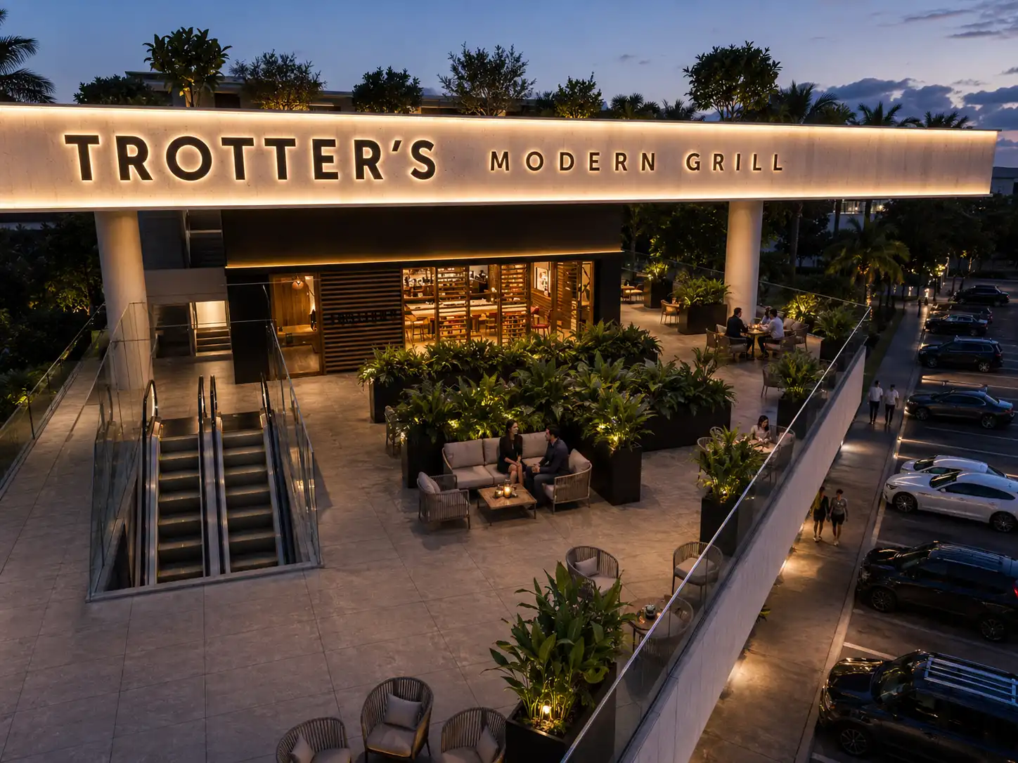 Fachada iluminada de Trotter's Modern Grill al atardecer